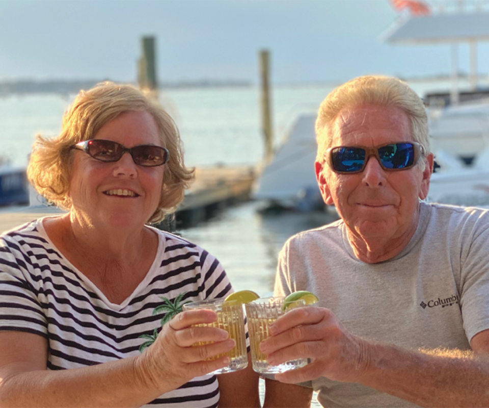couple cheering a glass