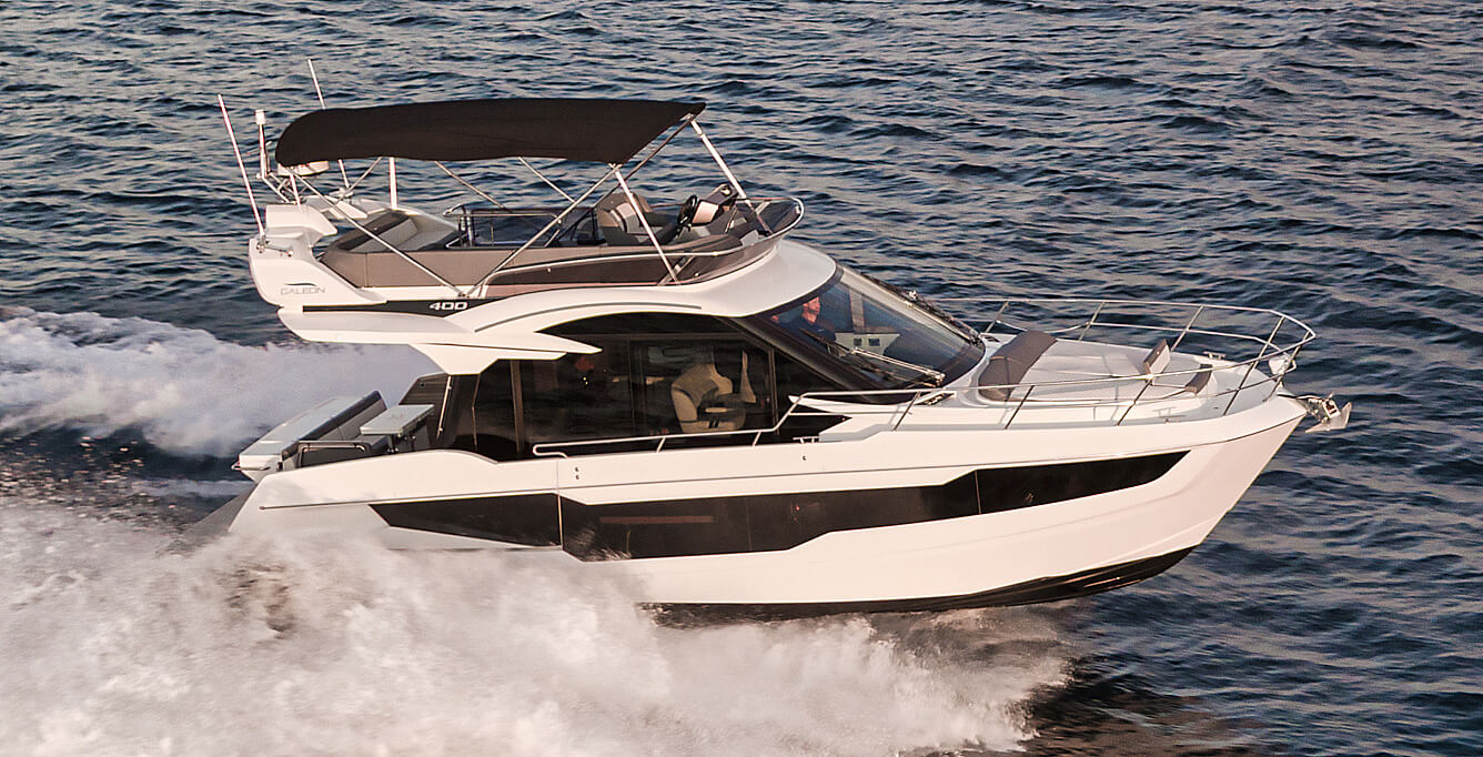 The starboard bow of the Galeon 400 FLY yacht with the sky deck shade up
