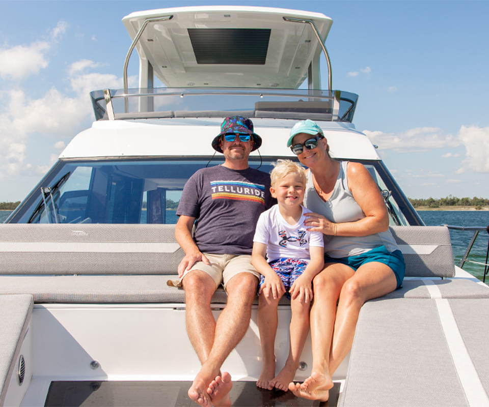 family sitting on the back of a galeon