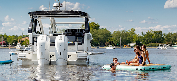 Group of people on a floatie infront of a galeon