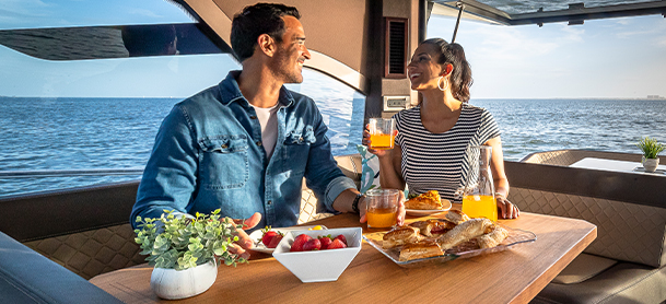 Couple having breakfast aboard a galeon