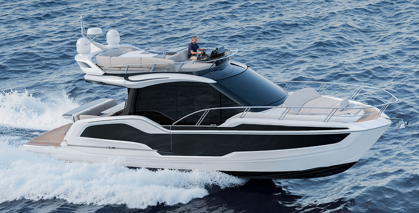 Galeon 420 FLY cruising on the water with its flybridge, bow lounge and starboard side profile visible.