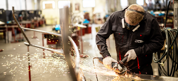 Galeon Factory Worker working on the steel
