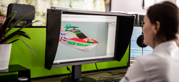 Galeon team member looking at renderings on her computer