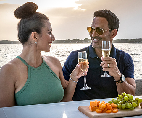 Couple cheering on a galeon yacht