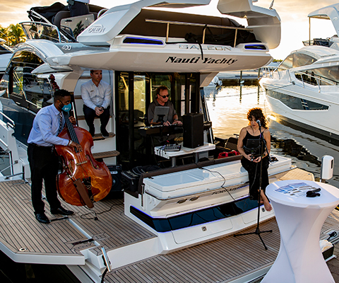 A band playing music on a Galeon Yacht
