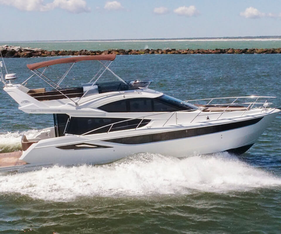 The Galeon 420 FLY yacht and its sky deck shade on the water 
