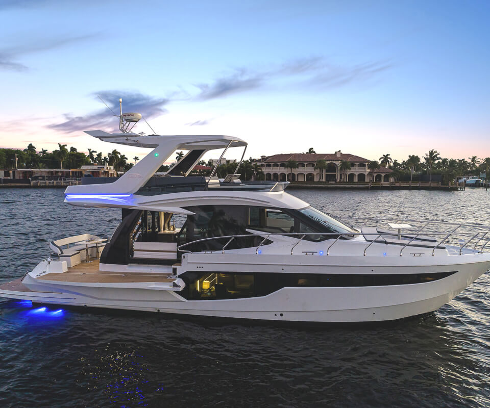 The Galeon 500 FLY yacht at sunset with it's rear LED lights on